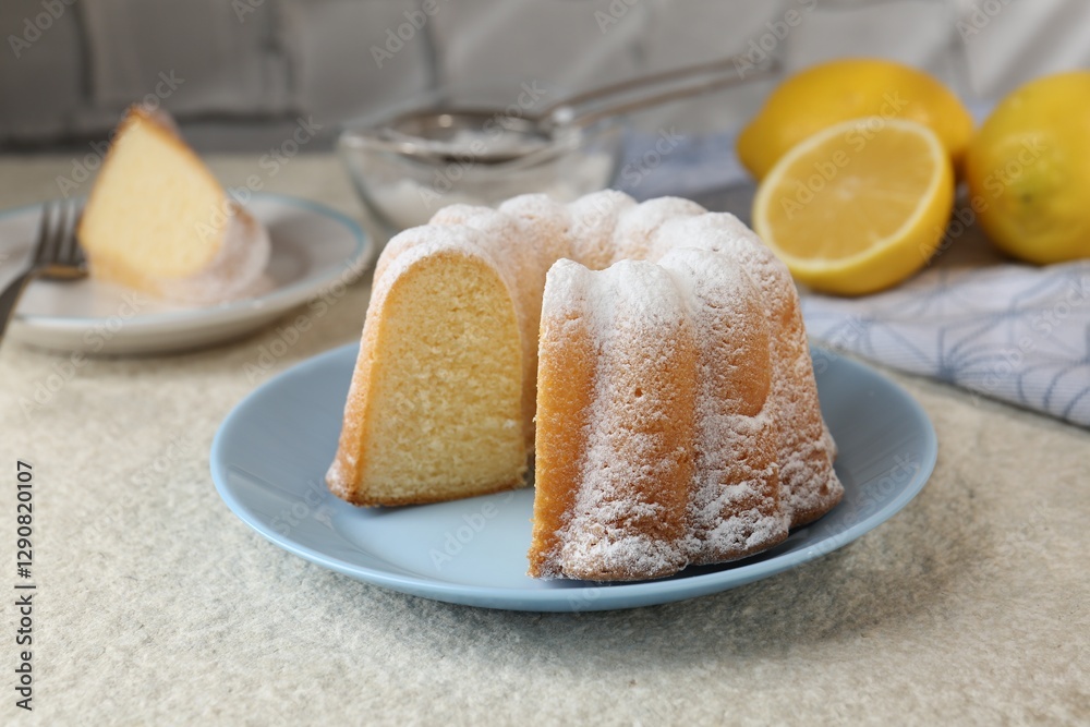 Canvas Prints Delicious lemon cake with powdered sugar on light textured table, closeup