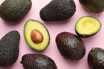 Fresh ripe avocados on pink background, flat lay