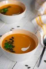 pumpkin soup in a white bowl
