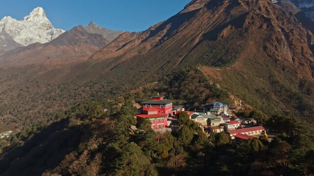 Aerial view of Tengboche Monastery, Tibetan Buddhist monastery in Khumbu valley of eastern Nepal, revealing majestic Ama Dablam peak in the background