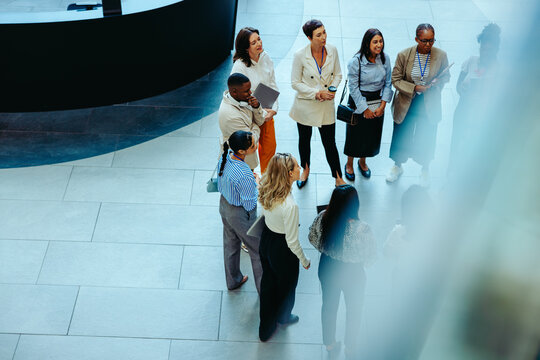 Diverse group of business professionals gathered in the lobby of an accounting firm