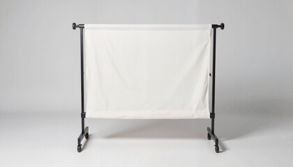 White fabric room divider on a black metal frame. Linen shirt, Bamboo fiber clothing, Recycled fabric, Zero waste fashion, Second hand, Biodegradable fabrics