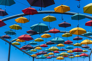 Colorful umbrellas hanging in the air