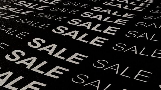 The inscription "SALE" on a black fabric imitating a wave