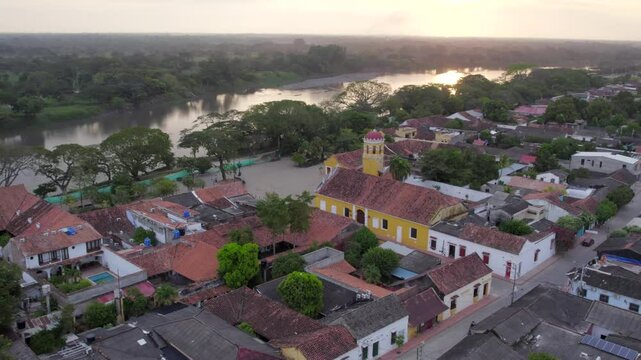 As the drone approaches Santa Barbara Church, it gracefully rolls left while yawing right, creating a smooth, cinematic sweep around the facade.