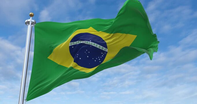 Brazil flag with flagpole waving in wind, rolling clouds background looping, 4K video (Perfect Loop)