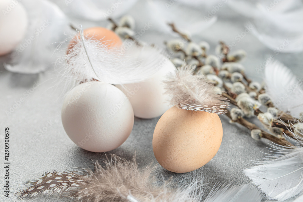 Wall mural easter composition with a willow branch and eggs on a light background. top view. place for text