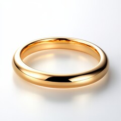Gold ring on white surface