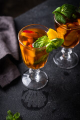 Cold ice tea with peach and mint