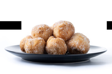 Traditional Carnival fritters or buñuelos e viento isolated on white background. .