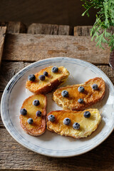 French toast with blueberry. Top view, wooden background