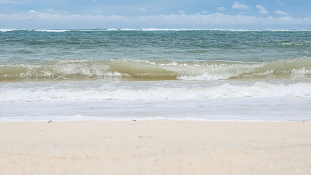 BALI, INDONESIA - JANUARY 22, 2018: Ocean waves on Pandava Beach, Bali.