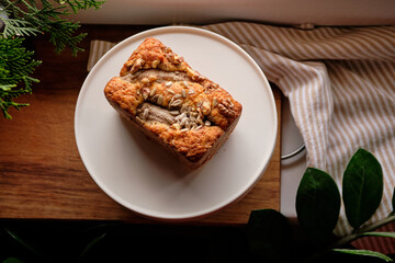 Bananabread decorated with sunflower seeds and banana