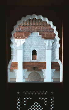 View of ornate traditional architecture with intricate mosaic windows and arches, Marrakech, Morocco.