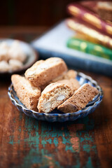 Cantuccini (Italian cookies) on dark wooden background. Close up