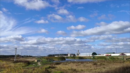 Obraz premium Charming view of the countryside, lake and fishing bridge. The picture opens up a peaceful and harmonious picture, showing a peaceful suburban life.