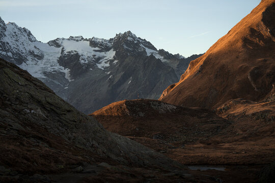 View of lacs de fenetre at sunset with majestic mountains and tranquil landscape, La Fouly, Switzerland.