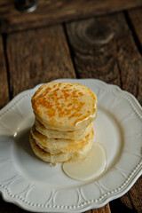 pancakes with honey. Wooden background, top view.