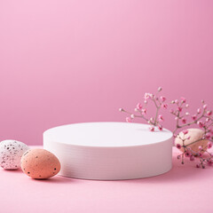 Abstract empty white podiums for products presentation or exhibitions on pink background with Easter quail eggs. Trend Concept with copy space.