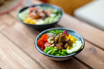 Colorful vegetable poke bowls on a summer table, showcasing fresh, healthy ingredients and vibrant seasonal vibes