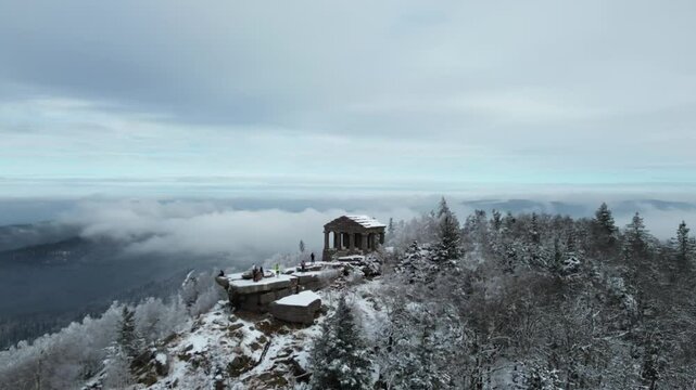 Drone footage of Temple du Donon covered in snow