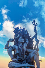 shiva statue with clear blue sky in Aazhimala Shiva Temple