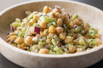 delicious healthy salad with chickpeas, cucumber, and feta cheese close-up
