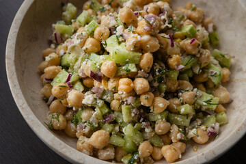 delicious healthy salad with chickpeas, cucumber, and feta cheese close-up