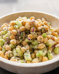 delicious healthy salad with chickpeas, cucumber, and feta cheese close-up