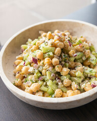 delicious healthy salad with chickpeas, cucumber, and feta cheese close-up