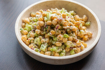 delicious healthy salad with chickpeas, cucumber, and feta cheese close-up