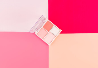 Makeup Palette on Colorful Pink Background for Beauty Concept