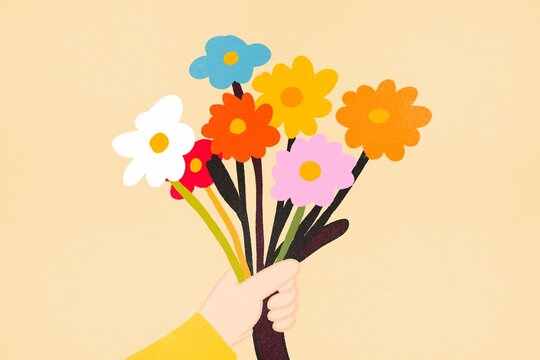 Hand holding a colorful bouquet of flowers