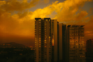 Twilight glow over cityscape apartment buildings