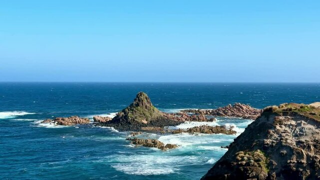 Stunning view from Pyramid Rock Lookout on Phillip Island, Australia. Breathtaking cliffs, rocks, and waves along the coastline create the perfect vacation spot by the ocean