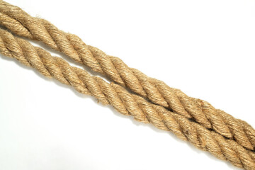Closeup view of two straight ropes string isolated over a white background