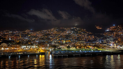 View of the cruise port and city of Funchal at night from a cruise ship