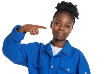 Confident young Haitian female mechanic in coveralls pointing sideways isolated on transparent white background