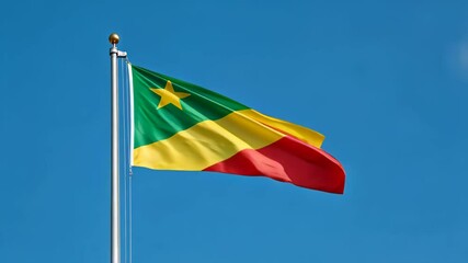 national flag of congo waving on blue sky, banner on the wind