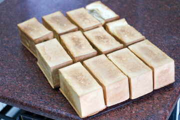 uncut bread still on the cooling tray