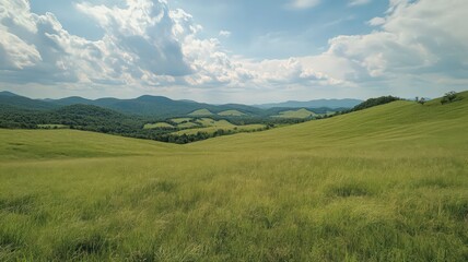 Obraz premium Lush Green Rolling Hills Under a Partly Cloudy Sky