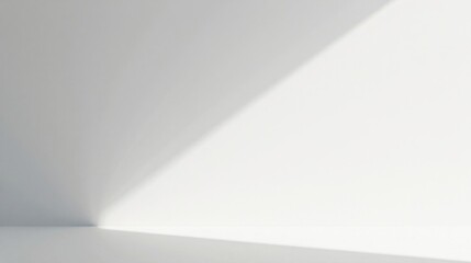 Minimalist White Room with Diagonal Sunlight Casting Shadows on Wall and Floor