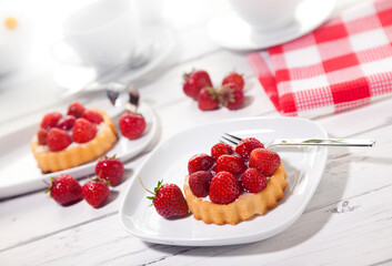Strawberry shortcakes on coffee table, tilted view