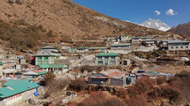 Shomare, a popular stop for trekkers and climbers, rests beneath the towering presence of Mount Everest in the Himalayas, showcasing the rugged beauty of Nepal