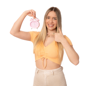 Portrait of cheerful young caucasian woman holding alarm clock isolated over transparent background. PNG transparent - Powered by Adobe