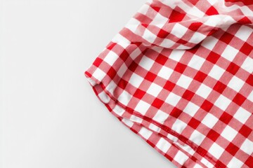 Red and white checkered tablecloth, white background, flat lay. A red gingham-patterned cloth folded neatly on top of the solid-color surface. Image isolated on a transparent background.