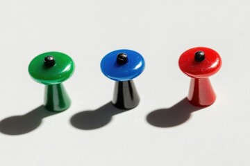 Isolated Black Thumbtack with Colorful Pins and Gentle Shadow on a Clean Background