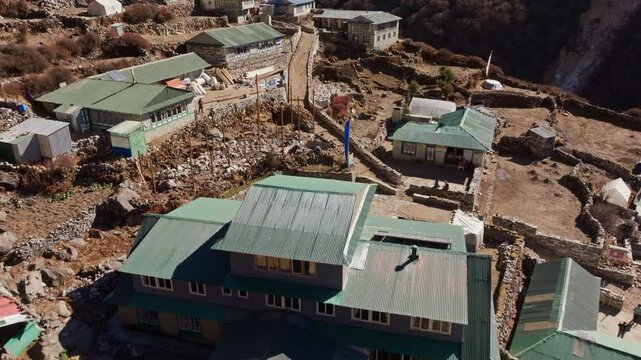Shomare, a crucial hub for Everest expeditions, showcases its unique architecture nestled amidst the Himalayas, with Ama Dablam majestic peak gracing the backdrop