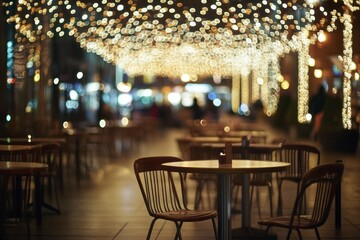 Blurred restaurant interior with tables and chairs for background use. Blurred image of a modern cafe or food hall with people in the evening, bokeh lights. Copy space banner for design presentation.