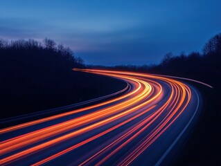 light trails on winding road at night